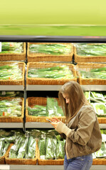 Girl  buying vegetables at the market