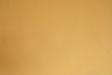Stained yellow cement wall backgrond and textuure