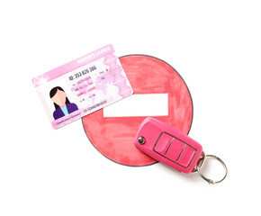 Driving license with car key and road sign on white background