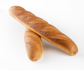  two wheat baguettes on a white background