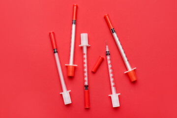 Syringes for insulin injection on color background. Diabetes concept