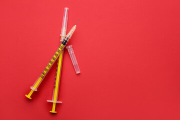 Syringes for insulin injection on color background. Diabetes concept