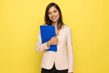 Fototapeta premium confident young businesswoman holding blue clipboard