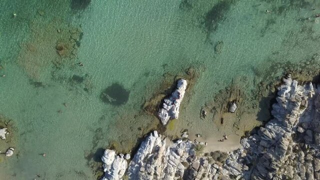 Aerial drone video of sandy beach blue sea water, clear blue sky Paros island Cyclades, Greece