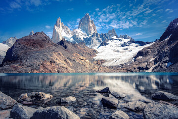 Stunning panoramic view from the lagoon of Los Tres towards Mount Fitz Roy and Cerro Torre in Los Glaciares National Park near El Chalten, Argentina
