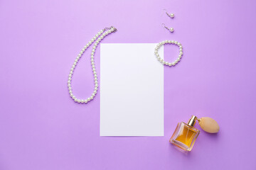 Composition with blank card and female accessories on color background