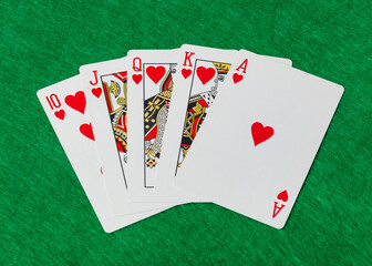 Casino playing cards on green table