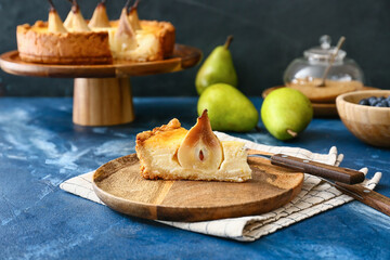 Plate with tasty pear cake on table