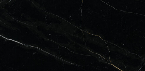 Luxurious black agate marble texture with golden veins, polished marble quartz stone background...