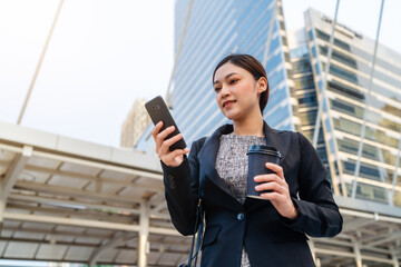 business woman using smartphone in city