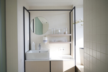 Photo of modern and clean bathroom with amenities