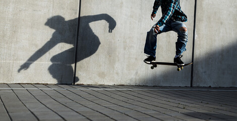 Skateboarder riding fast towards the ramps to be lifted into the air and perform a trick