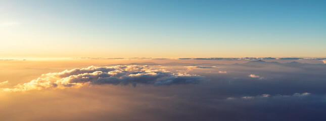 A panoramic top view of sunrise or sunset and over all clouds under the blue sky, Sky and clouds banner, wallpaper concept.