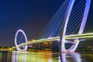 Obraz premium Eye of Nanjing Pedestrian Bridge and urban skyline in Jianye District, Nanjing, China