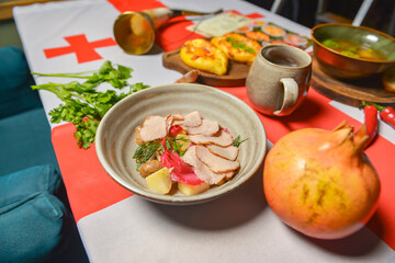 Traditional Georgian food on a National Georgia flag background. Top view, flat lay concept, menu concept.