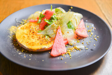 Watermelon and cucumber cheese salad with mint and melon. Watermelon summer menu, seasonal meal concept.