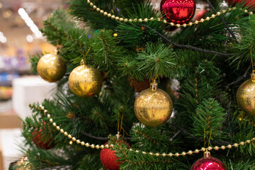 Ornate Christmas tree, golden garland and red golden balls in rows. Festive Christmas background design horizontal.