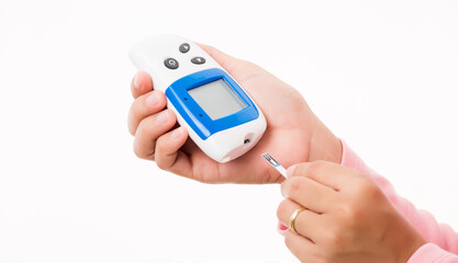 Closeup hand woman measuring glucose test level checking on finger by glucometer she monitor and control high blood sugar diabetes and glycemic health care medical concept isolated on white background