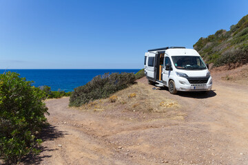 Fototapeta na wymiar camper and truck near the beach in italy 