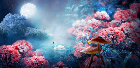 Fototapeta na wymiar Fantasy Magical Enchanted Fairy Tale Landscape With Swan Swimming In Lake, Fabulous Fairytale Blooming Pink Rose Flower Garden And Mushrooms On Mysterious Blue Background And Glowing Moon Ray In Night