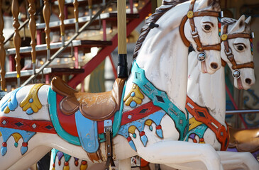 Wooden horse of the merry-go-round of the playground equipment of the park