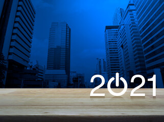 2021 start up business flat icon on wooden table over modern office city tower and skyscraper,...