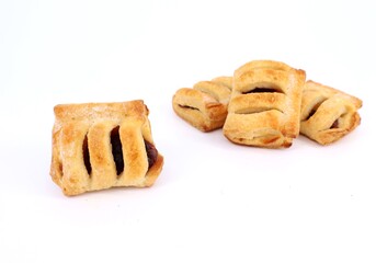 Mini strudels filled with berry jam on white background