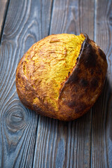 Homemade tartine bread on dark wooden table