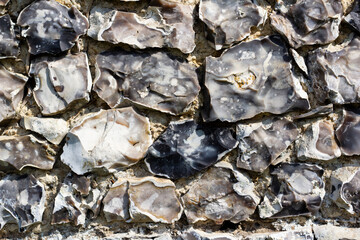 Close up detailed shot of a flint stone wall