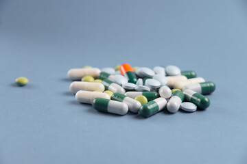 Coronavirus 2019-nCoV outbreak. Pills and drug, care during illness. Blue background.