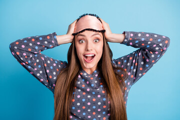 Closeup headshot photo of charming pretty young girl hands head open mouth find treasure chest full of gold backyard wear mask dotted shirt pajamas sleepwear isolated blue color background