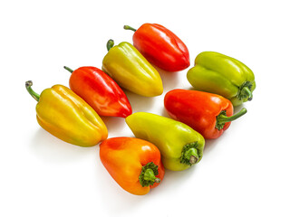Harvest of multicolored bell peppers on a white background