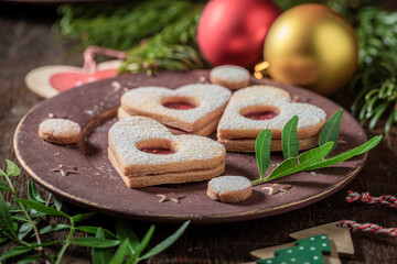 Traditionally stained glass cookies with Christmas ornaments and mistletoe