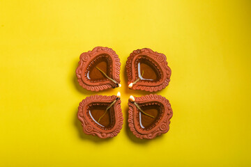 happy diwali or happy deepavali greeting card made using a photograph of diya or oil lamp