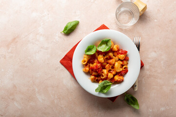 Overhead view of vegan pasta with tomato sauce, healthy food concept