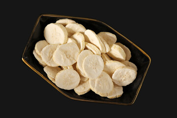 Pile of sweet dehydrated banana slices.