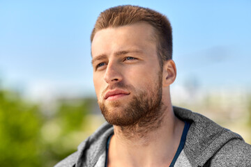 Fototapeta premium fitness, sport and people concept - portrait of young man outdoors