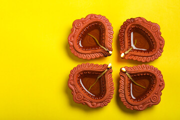 happy diwali or happy deepavali greeting card made using a photograph of diya or oil lamp