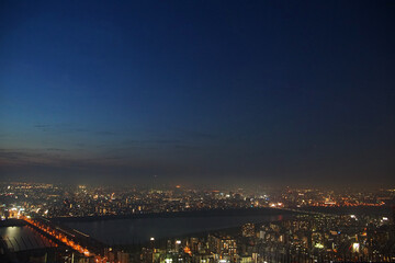 The river of the city of Osaka, Japan and night view of the light of the town
