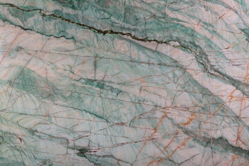 Emerald - natural polished quarzite stone in green color, photo of slab texture for perfect interior, background or other design project.