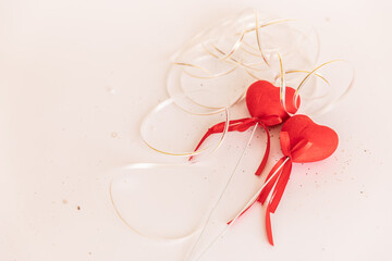 lovers' day. Valentine's Day. two red hearts on a white isolated background