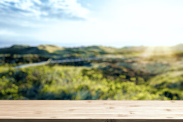 Wooden bar on bottom and blurred view of picturesque seaside landscape.