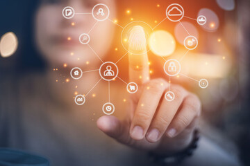 Business women use fingerprints to scan future web technology buttons and icons with virtual display.