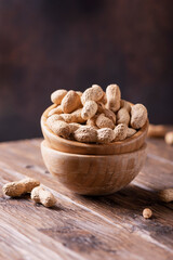  Roasted peanuts in wooden bowl