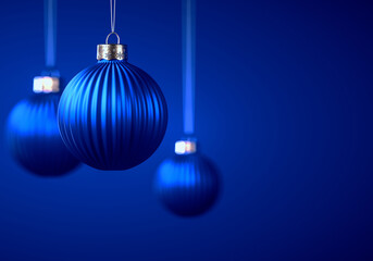 Group of three royal blue vertically striped Christmas balls.
