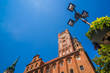 Fototapeta na wymiar Low angle shot of the Clock Tower of Ratusz building in Torun, Poland