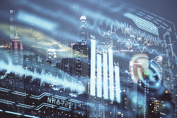 Double exposure of technology theme hologram and cityscape background. Concept of Hightech.