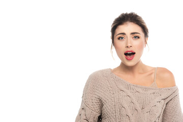 angry woman in knitted sweater screaming while looking at camera isolated on white