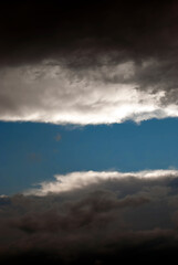 Tunnel in the clouds - dark clouds forming a tunnel in the sky.