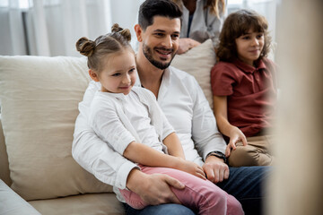 Fototapeta premium Family having fun while watching funny movie